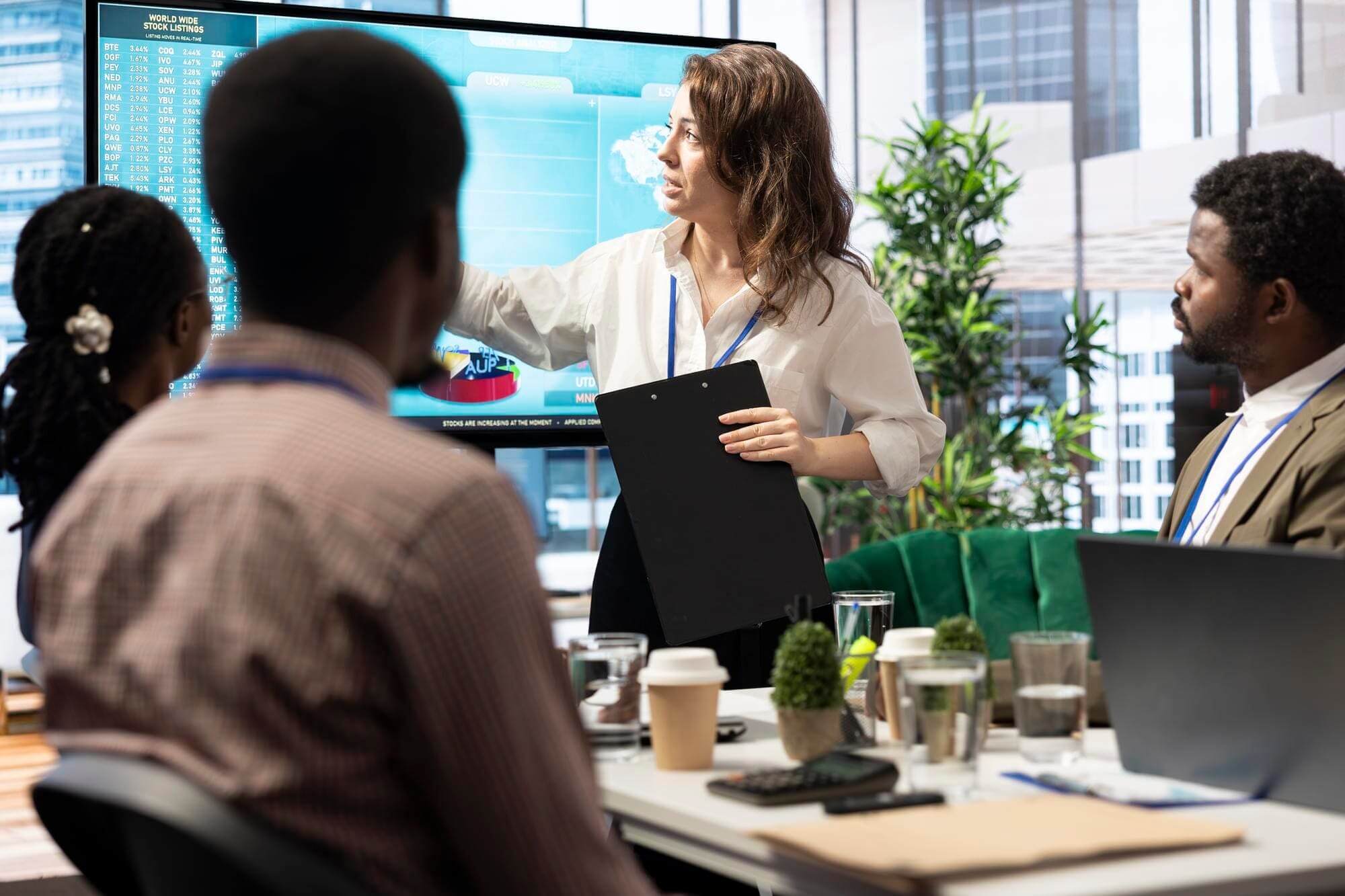 Business meeting with presentation in modern office.