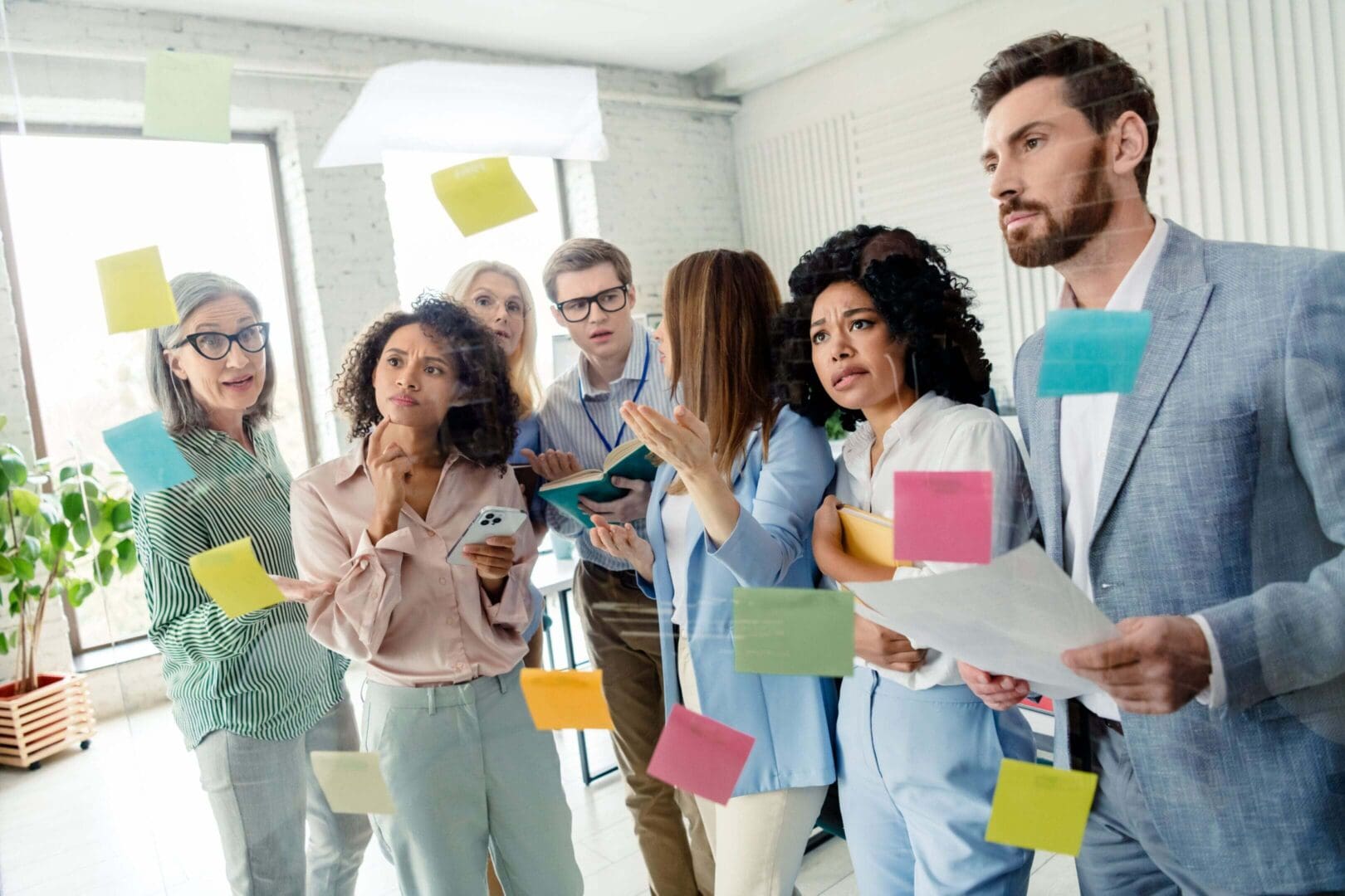 Team brainstorming with colorful sticky notes.