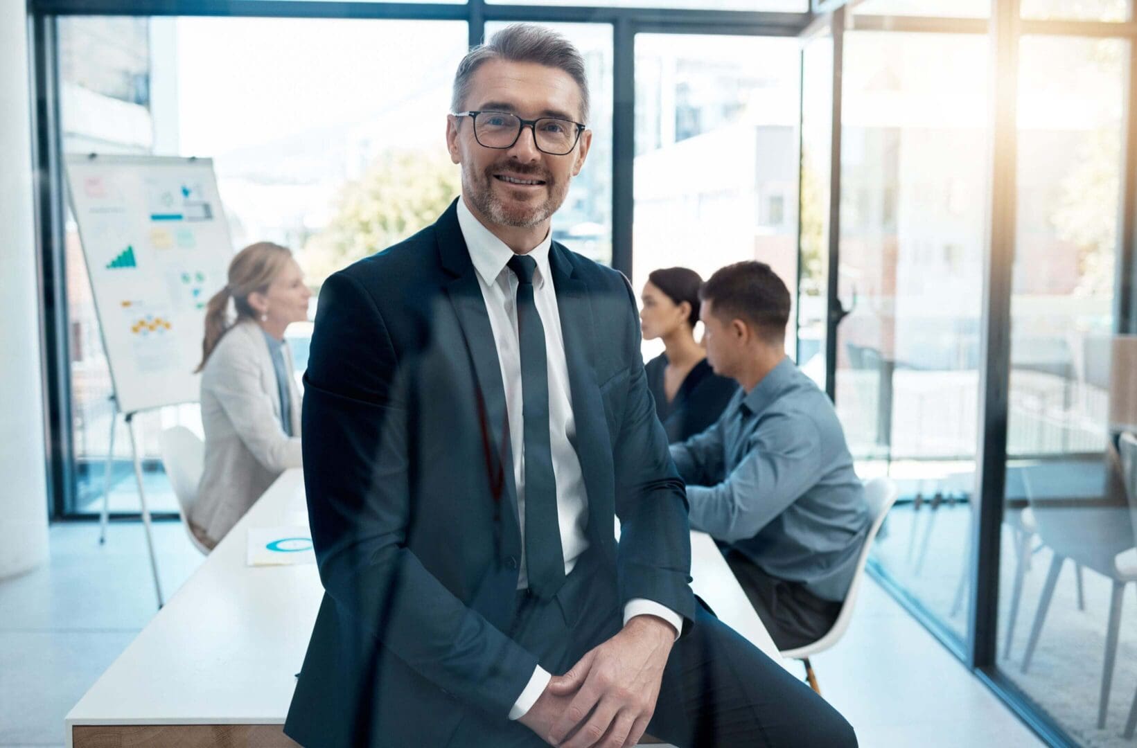 Businessman smiling in modern office setting.