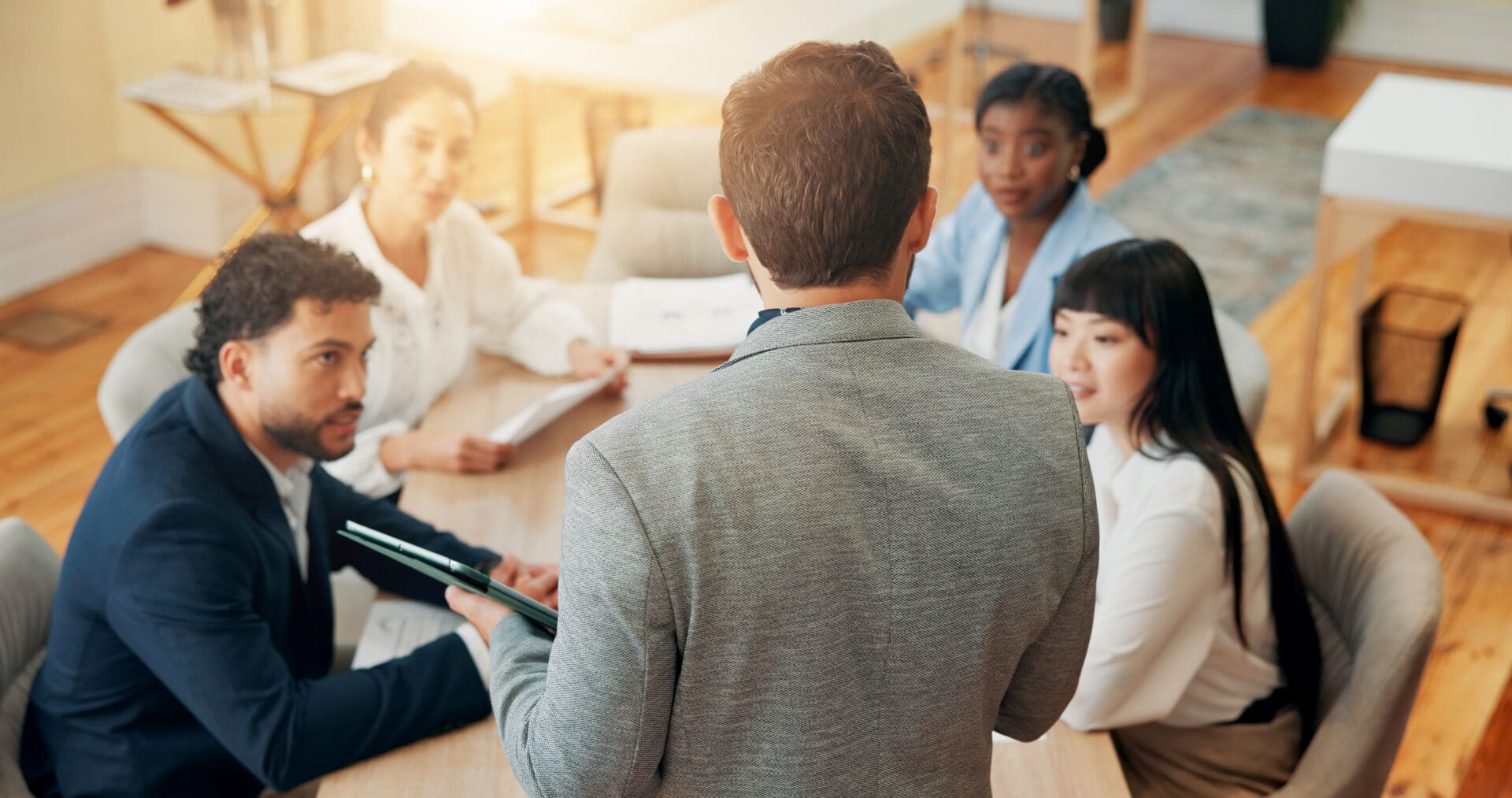 Office, meeting and back of manager with business people for planning, project discussion and teamwork. Corporate, professional and men and women in presentation for proposal, feedback and review