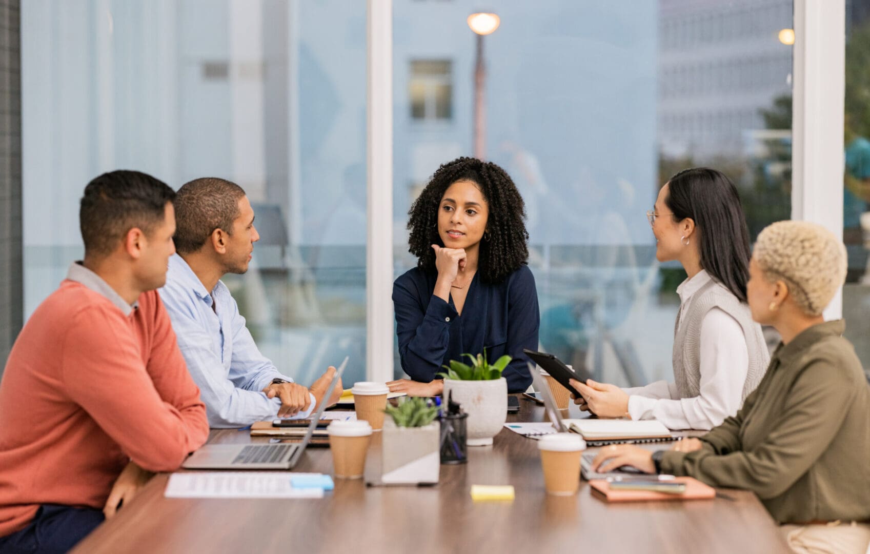 Team meeting around a conference table.