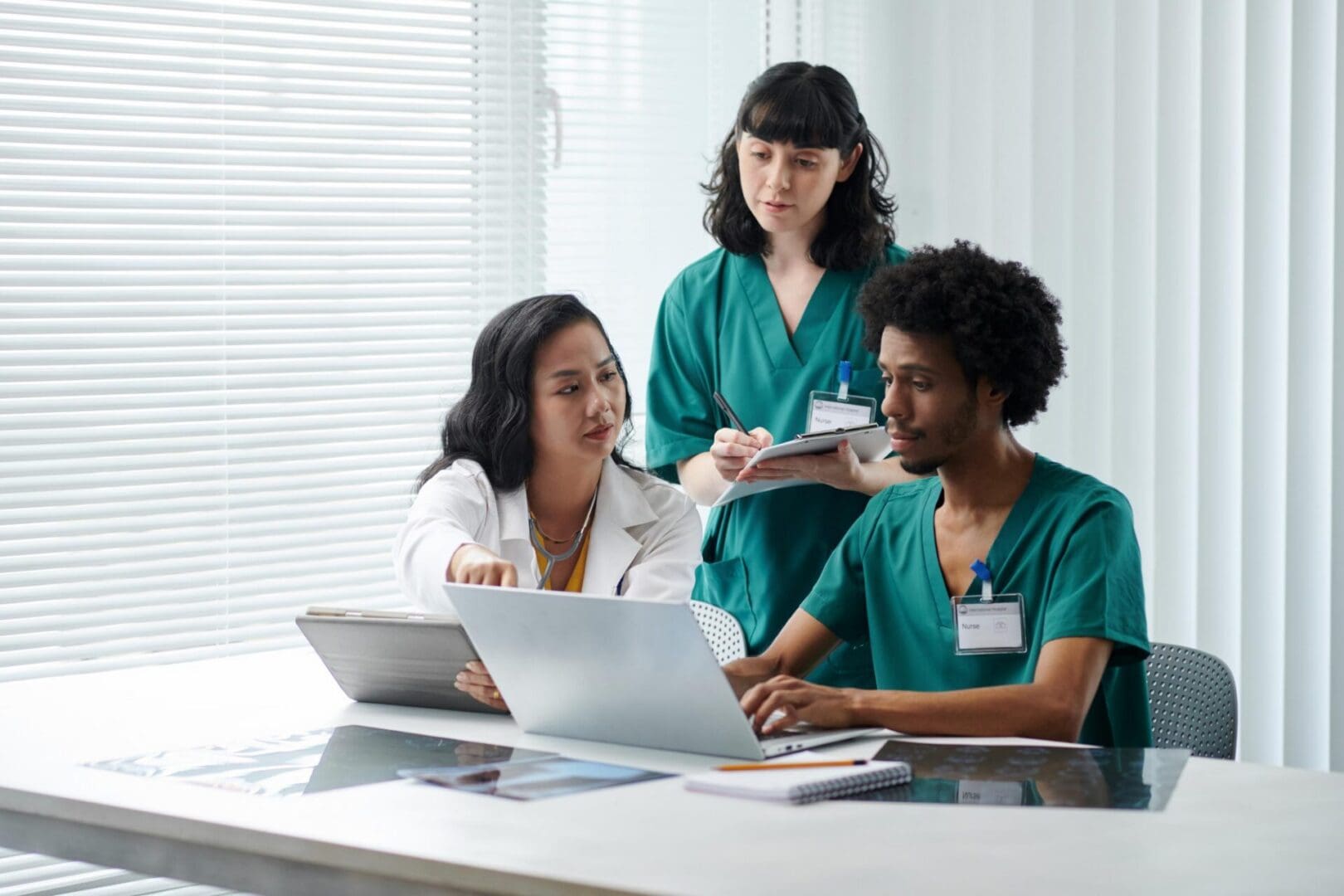 Physician asking nurses to prepare documents with patients data