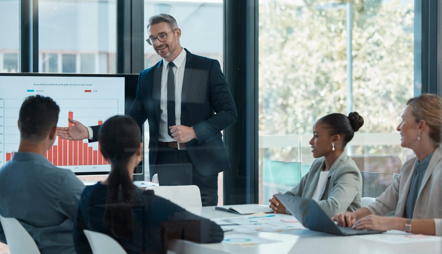 Meeting, training and planning with a CEO, manager or leader and his team in the boardroom. Collaboration, workshop and presentation with a business man and staff talking about vision and mission