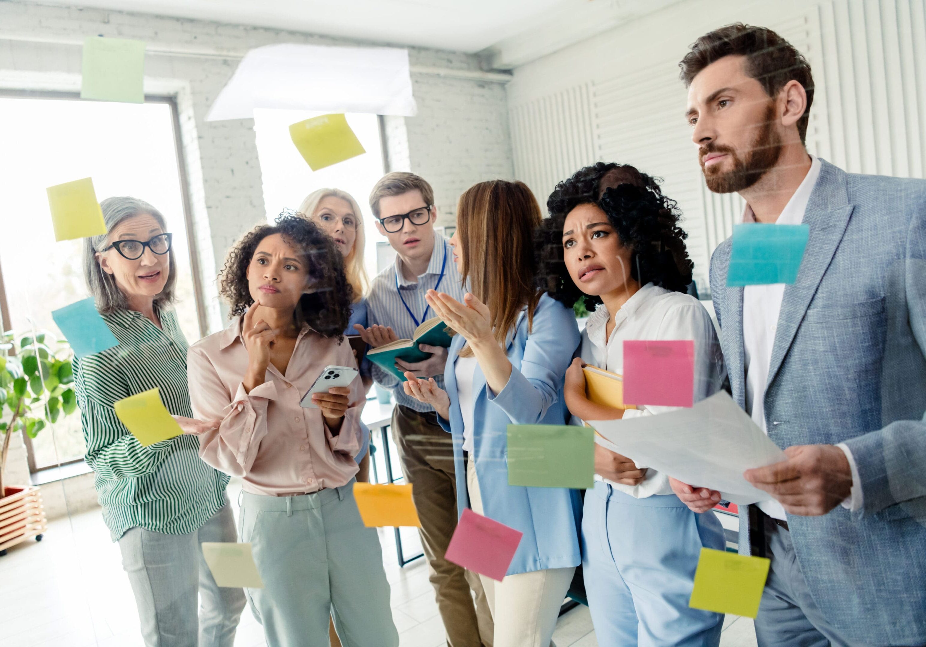 Team brainstorming with colorful sticky notes.