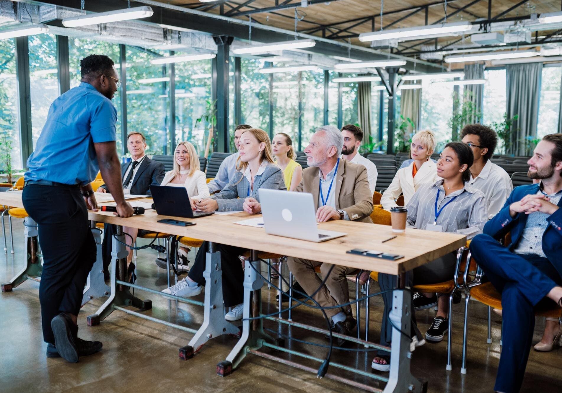 Business presentation with diverse audience in office.