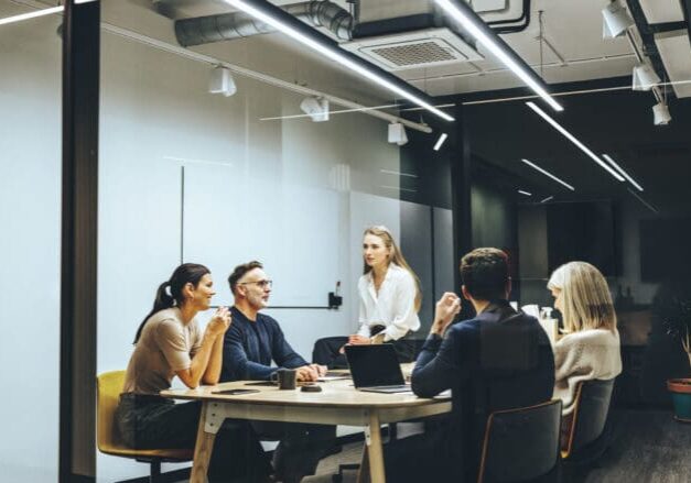 Team meeting in modern conference room.