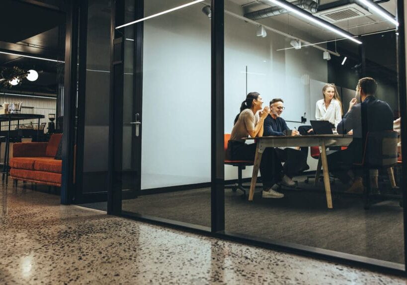 People having a meeting in modern office.