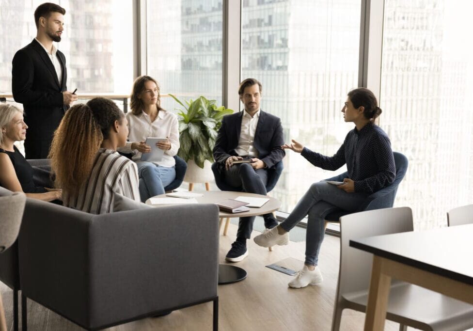 Group discussing in a modern office space.