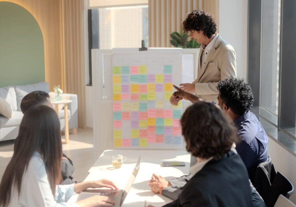 Team brainstorming with colorful sticky notes.