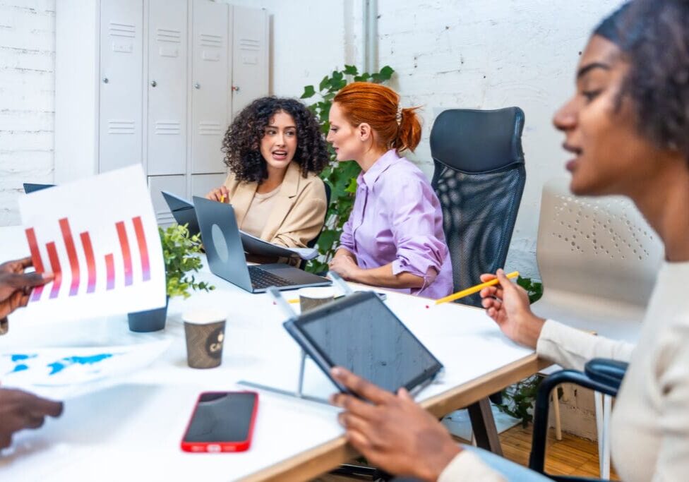Group collaborating in a modern office setting.