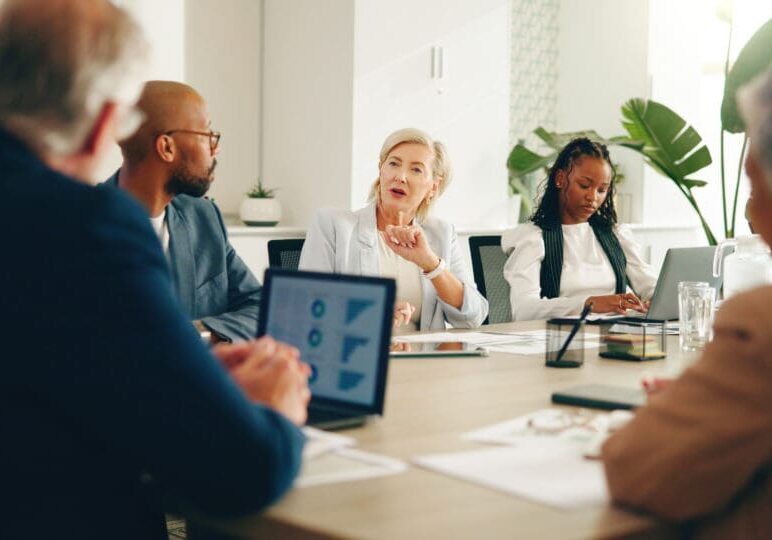 Business meeting with diverse team discussing ideas.