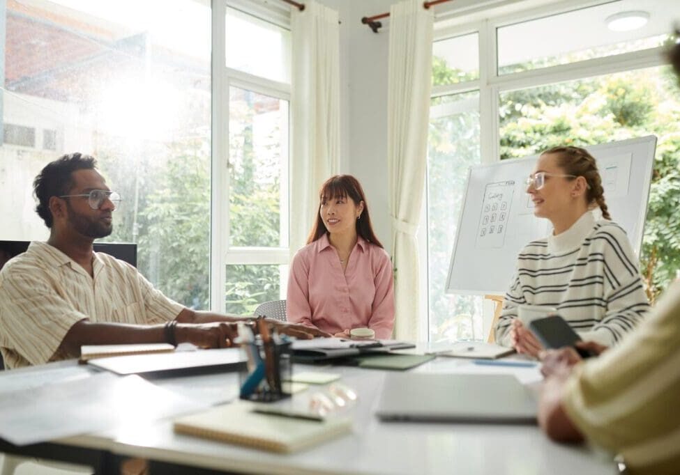 Group meeting in a bright office room.
