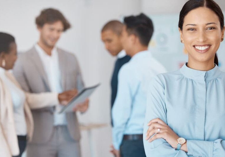 Smiling professional woman in office setting.