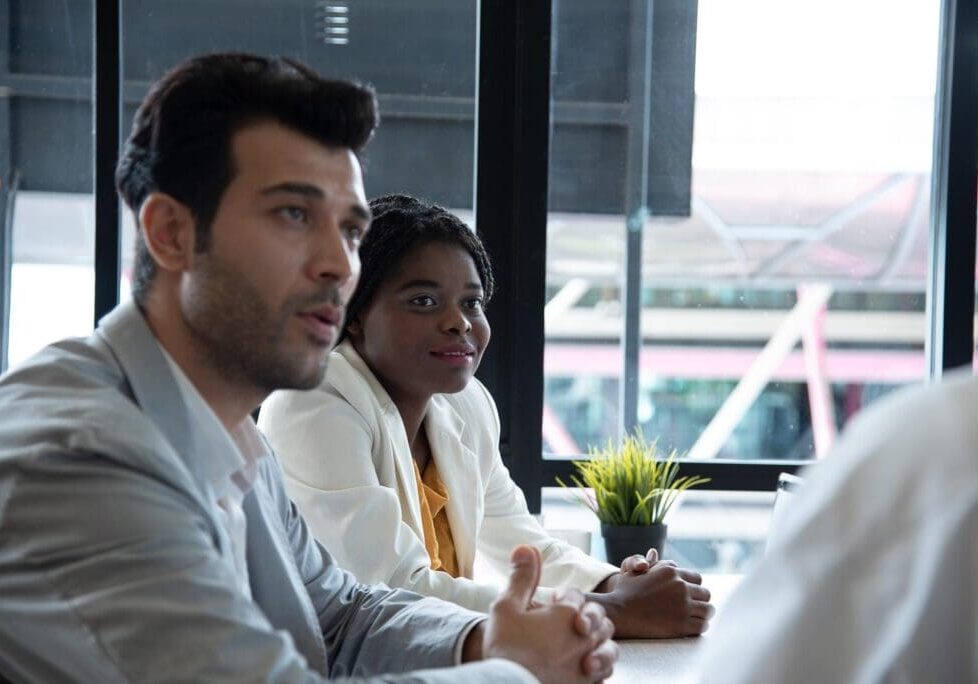 Two people in a business meeting.