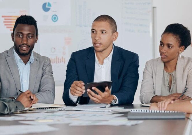Leadership, planning and talking about ideas with marketing, advertising or finance team using tablet in corporate office. Business people together for collaboration, teamwork and project management