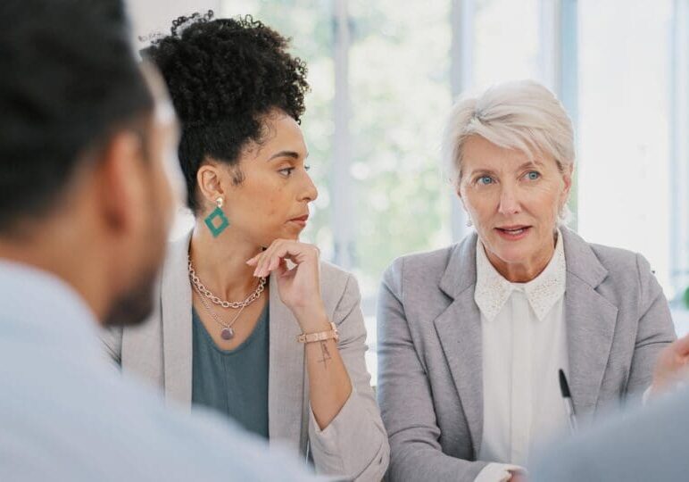 Teamwork, documents and women in business meeting for planning, strategy and marketing report. Collaboration, management and professional workers in discussion with paperwork, review and proposal