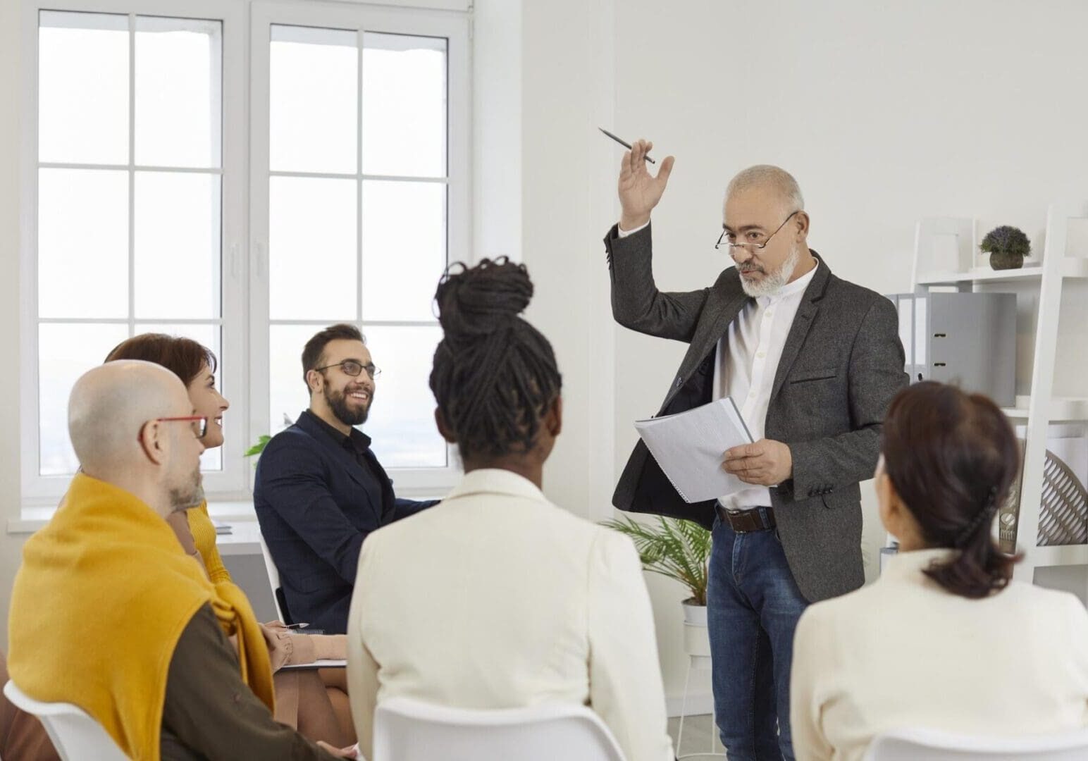 Man presenting to small group