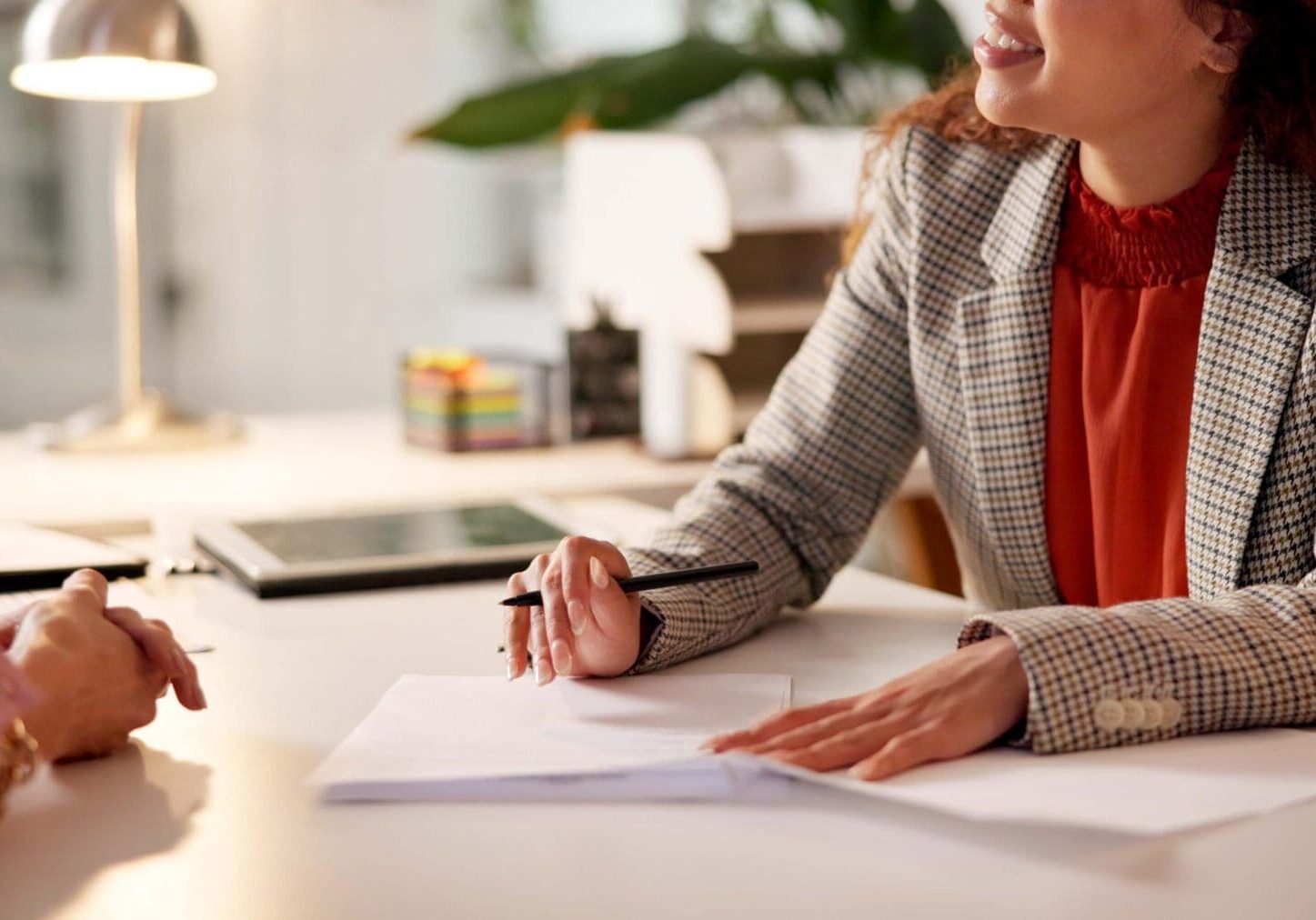 Contract, woman and hands of advisor for interview, information or document for job application. Advice, client or human resource agent with paperwork for registration, opportunity or deal agreement