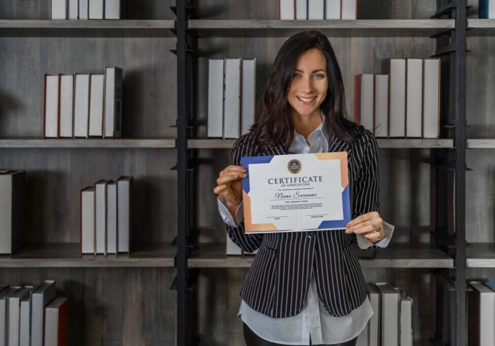 business portrait of caucasian business woman posing with certificate of appreciation recieved from business performace competition award winning