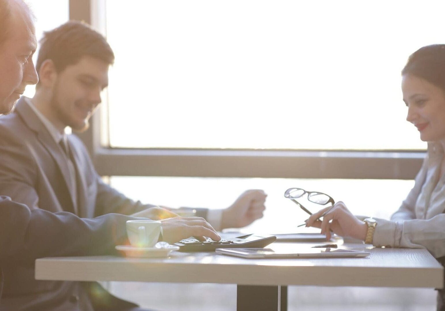 Business colleagues meeting with calculator and glasses