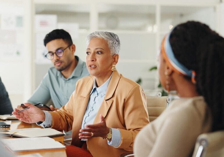 Woman leading a business team meeting