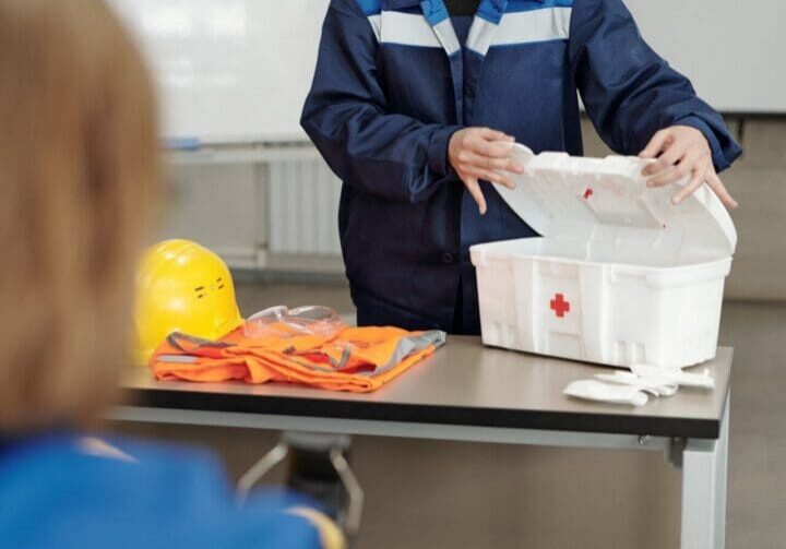 Safety instructor demonstrates first aid kit