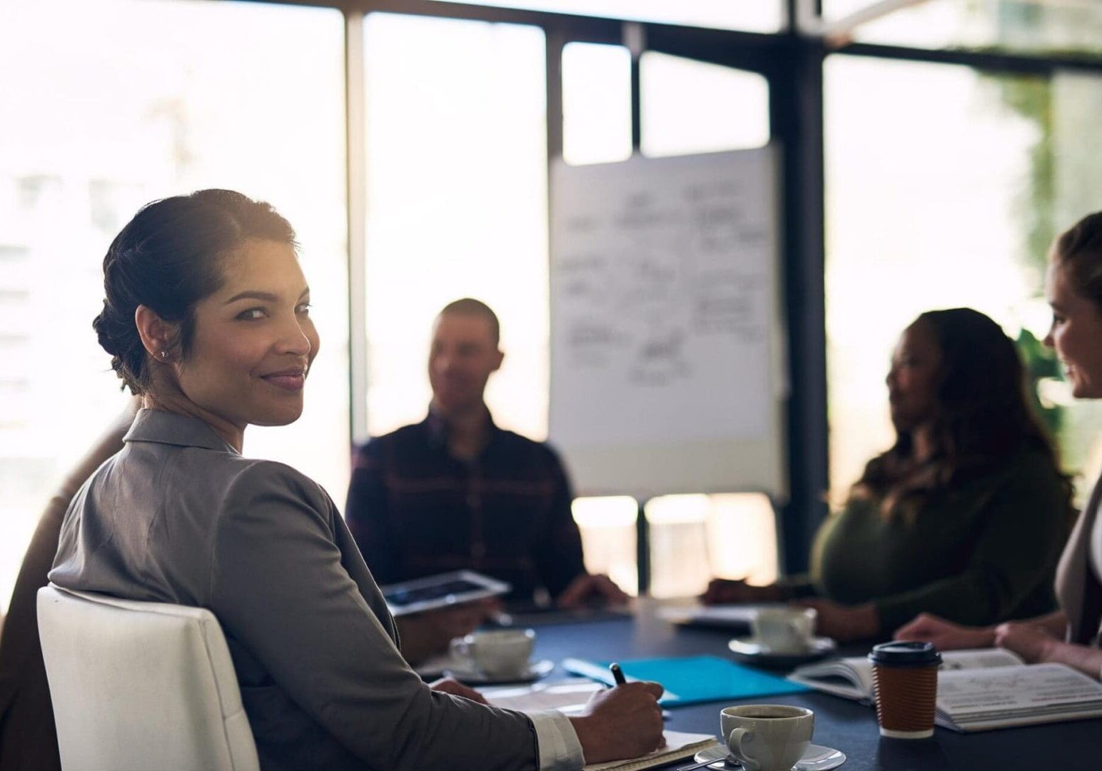 Woman smiling during a business meeting