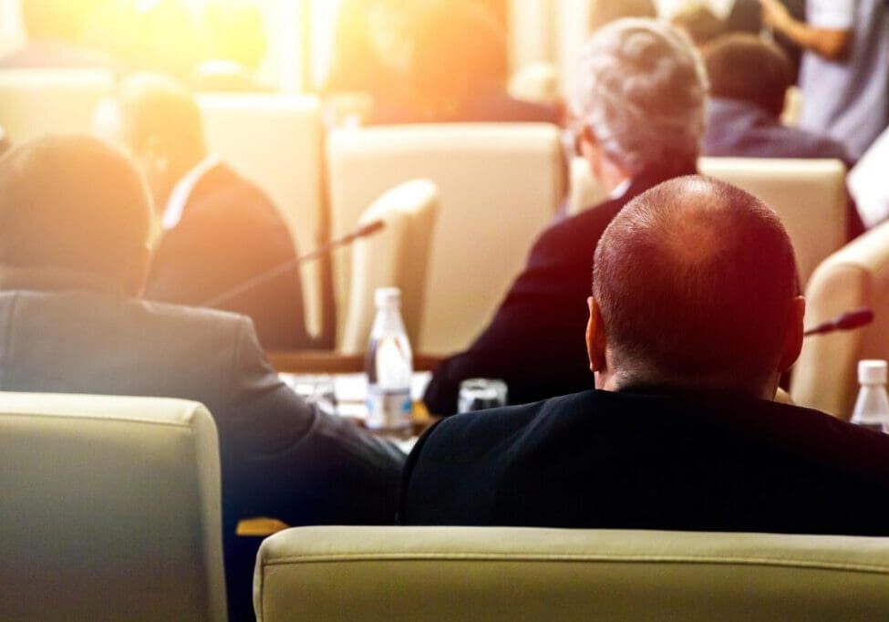 Back view of people in conference room