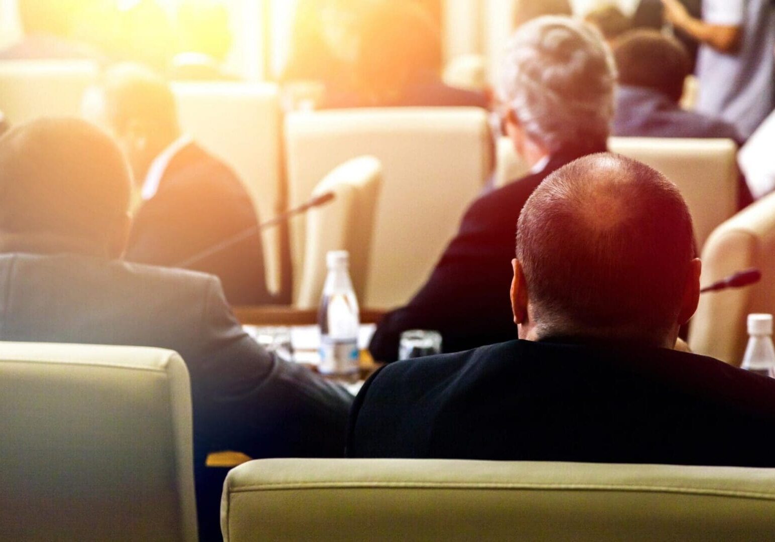 Back view of people in conference room