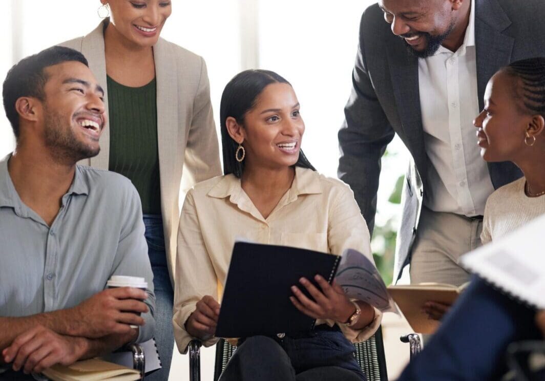 Diverse coworkers smiling during a collaborative meeting
