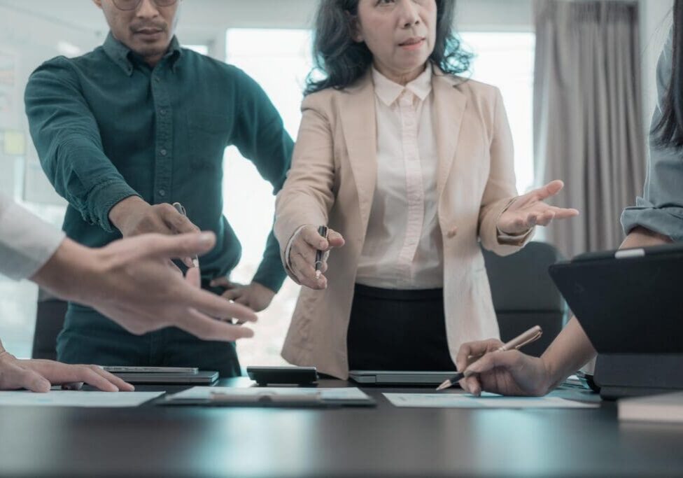 A team of creative Asian business leaders brainstormed and presented a roadmap for product launch, planning, strategy, and new business development.