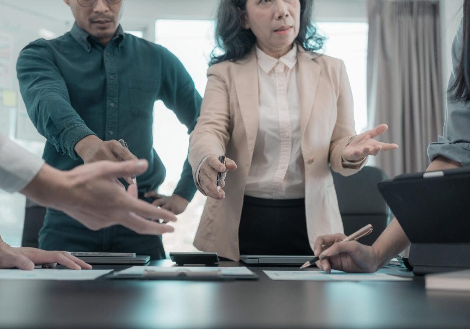 A team of creative Asian business leaders brainstormed and presented a roadmap for product launch, planning, strategy, and new business development.