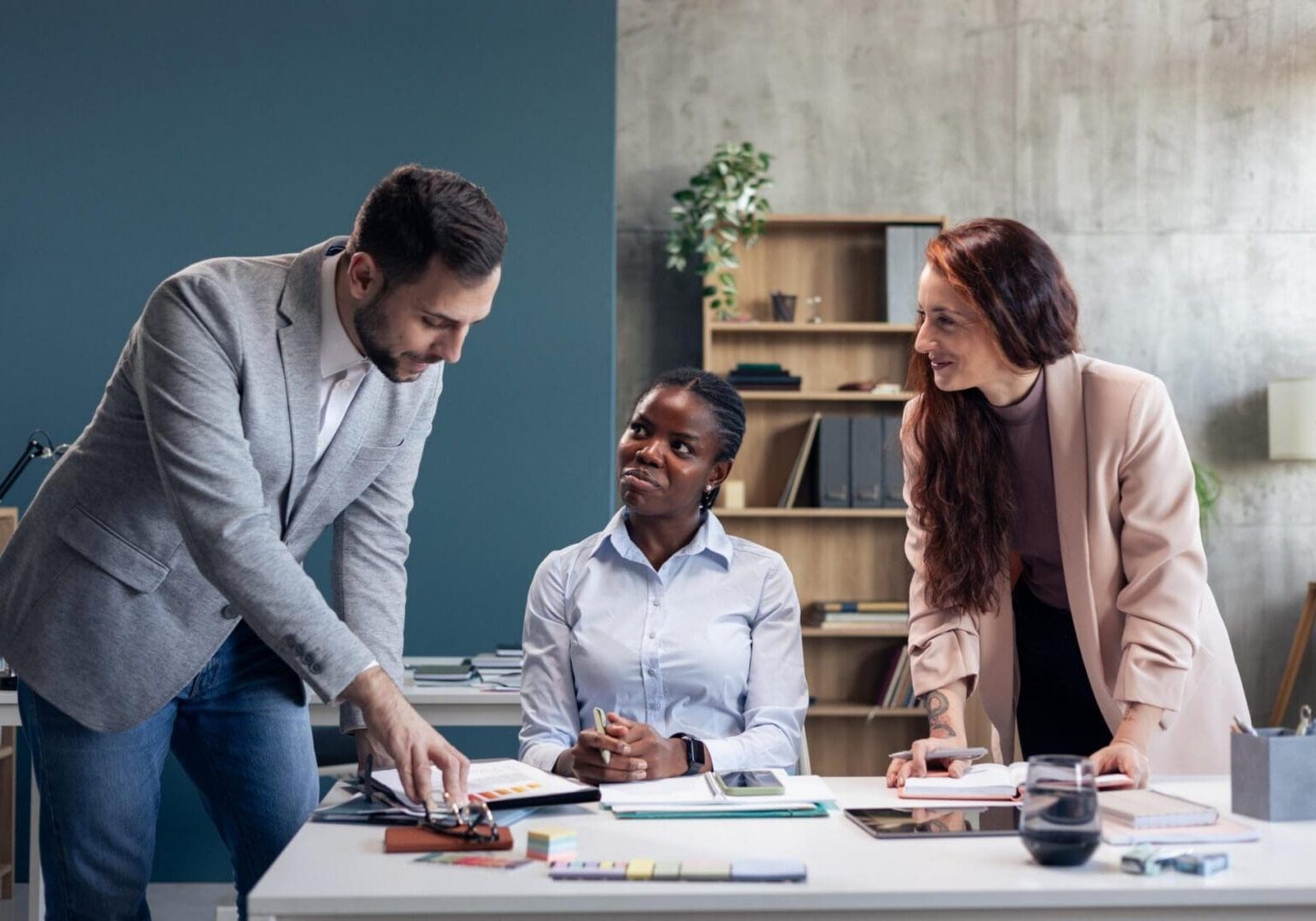 Diverse business team collaborating and analyzing documents during an office meeting