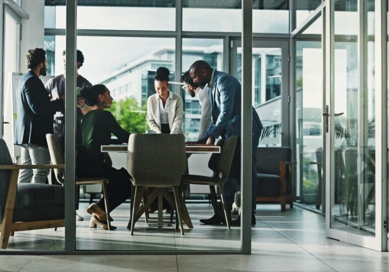 Meeting, collaboration and business people in office with finance review for budget planning. Teamwork, corporate and group of financial advisors with discussion for investment proposal in workplace.