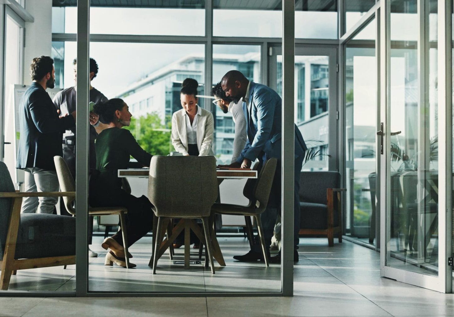 Meeting, collaboration and business people in office with finance review for budget planning. Teamwork, corporate and group of financial advisors with discussion for investment proposal in workplace.