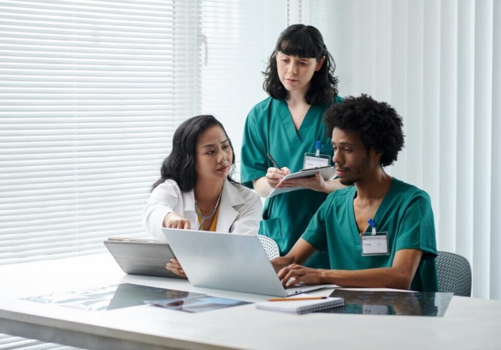 Physician asking nurses to prepare documents with patients data